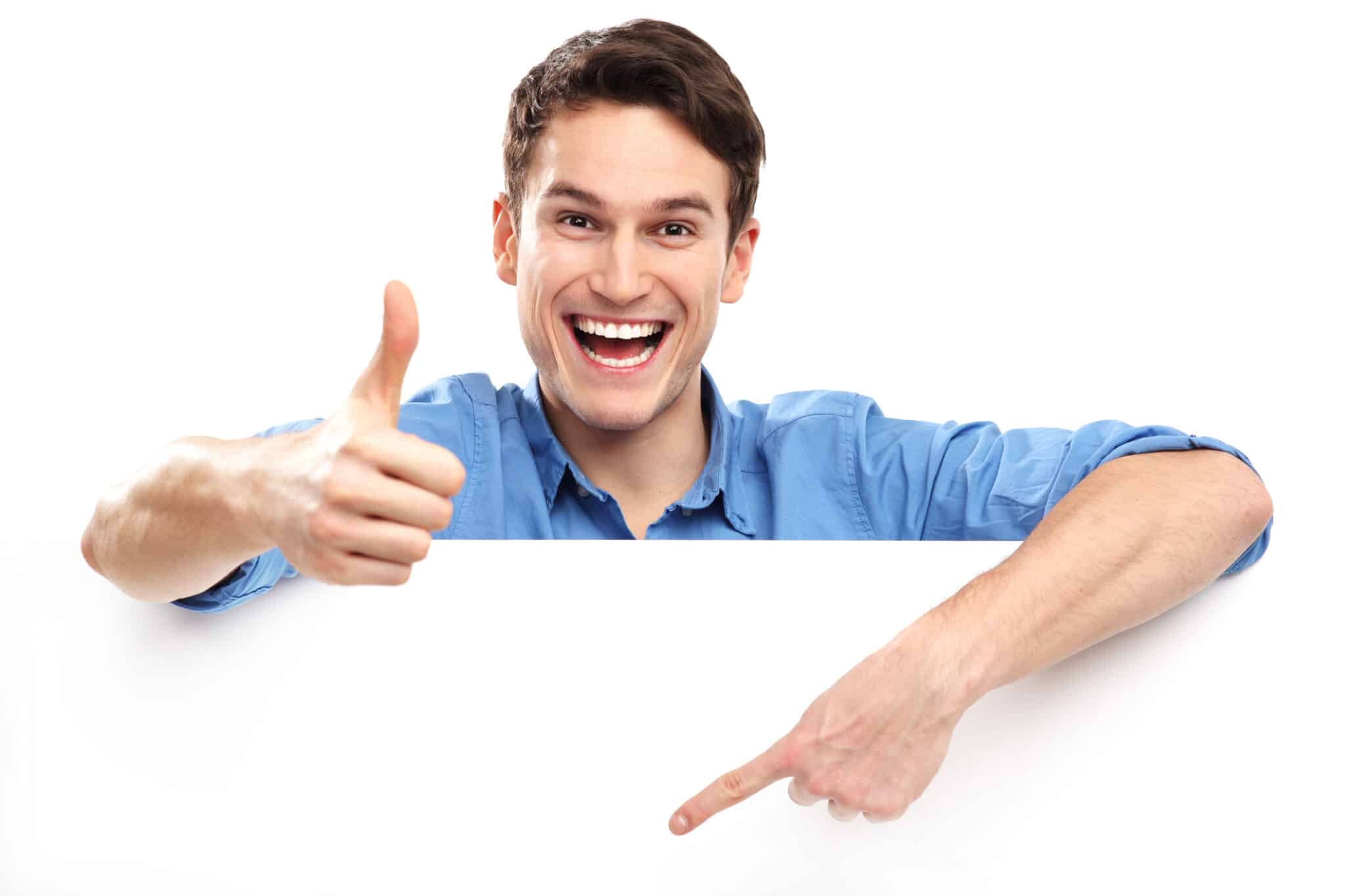 A man showing a thumbs up for choosing the right air conditioner installation service by One Hour Heating & Air Conditioning of San Diego, while holding a blank board.